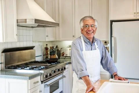 HIspanic senior man in his remodeled kitchen Stock Photos