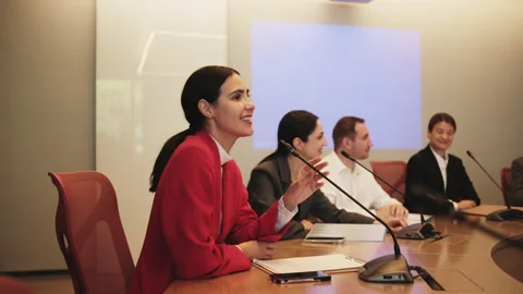 Hispanic speaker talking with microphone in seminar event in conference room. Stock Footage 334906453