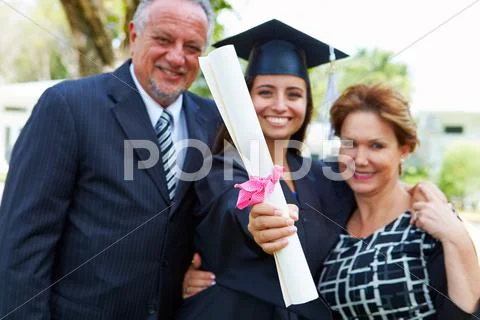 Hispanic Student And Parents Celebrate Graduation Stock Photos