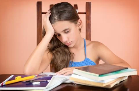 Hispanic student  exhausted after studying too much Stock Photos