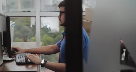 Hispanic Tech Support Man Fixing White Woman Computer in Office Stock Footage 100444078