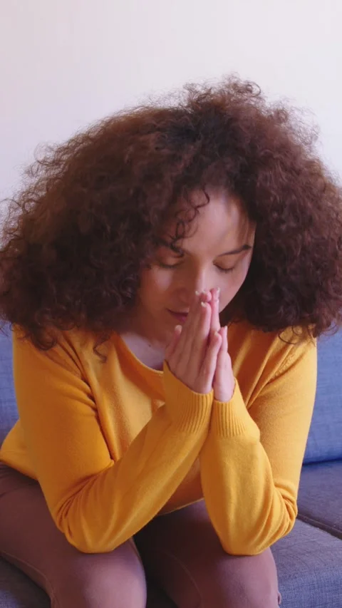 Hispanic Woman Praying for a Solution to an Important Problem Stock Footage 305245179