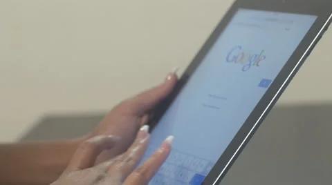 Hispanic woman using the internet on a tablet Stock Footage 56346764