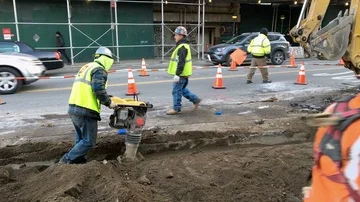 Hispanic/Latino Construction Worker Uses Dirt Compactor at Construction Site Stock Footage 85614995