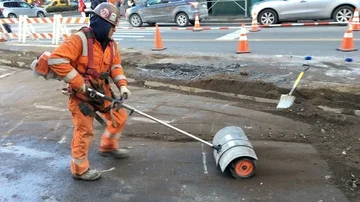 Hispanic/Latino Construction Worker Uses Power Broom at Construction Site Stock Footage 85614940