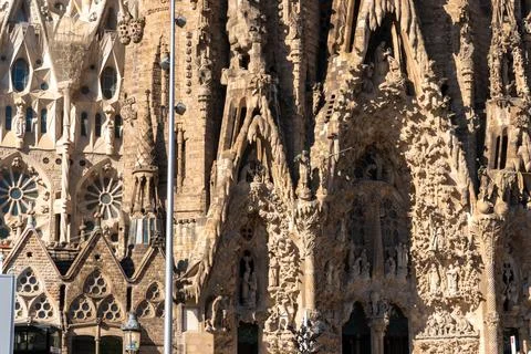 Historic architectural facade dominates frame with sculpted stonework, arch.. Foto stock