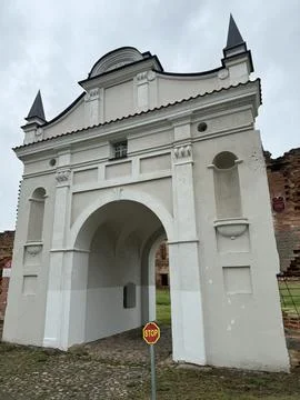 Historic Archway with Cobblestone Path and Stop Sign Stock Photos
