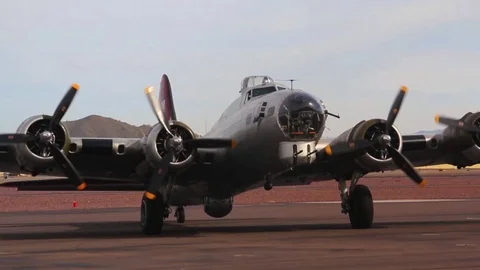 Historic B-17 Bomber Winds Down Quad Engines on Runway after Landing Stock Footage