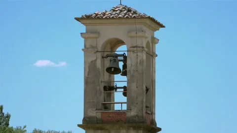 A historic bell tower and a bell in an old church in an Italian village. Stock Footage