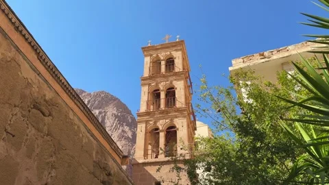 Historic bell tower of Saint Catherine Monastery against Sinai mountains on Stock Footage 341650251