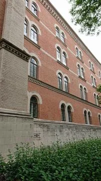 Historic brick building with arched windows Stock Photos