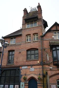 Historic Brick Building, Weathervane, Alan Sillitoe Plaque, Nottingham, England. Stock Photos