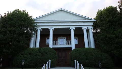 Historic brick building with white columns Stock Footage 337796104