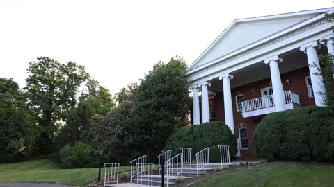 Historic brick building with white columns Stock Footage 338033802