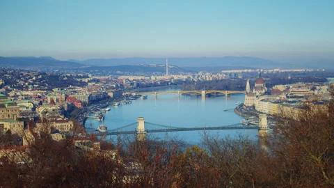 Historic bridge spanning the river in Budapest with city buildings Stock Footage 326066810