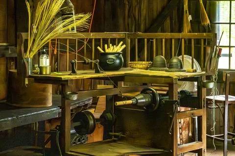 Historic broom-making workshop interior with tools Stock Photos