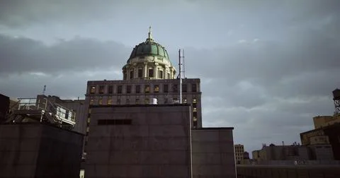 Historic building with dome against cloudy urban sky in evening light Ilustración de archivo