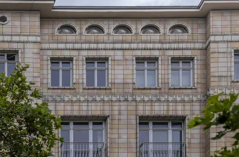 Historic Building Facade with Arched Windows and Geometric Patterns, Berlin.. Stock Photos