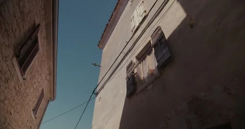Historic building facade with shutters viewed from below in Bale Vídeo Stock 334001690