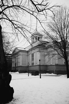 Historic Building Framed by Bare Trees in Helsinki Stock Photos