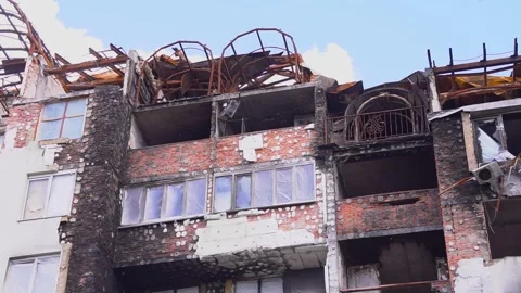 Historic building with numerous windows being demolished, revealing sky Stock Footage 274572491