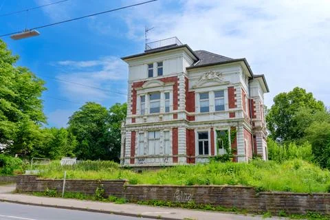 Historic Building Surrounded By Overgrown Vegetation In Hattingen 스톡 사진