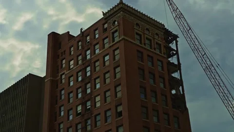 Historic Building Undergoes Top-Down Demolition by Crane Stock Footage 312224602