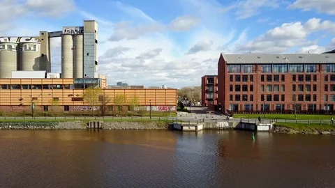 Historic buildings converted into condos overlooking a canal. Video stock 86018560