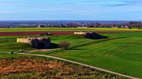 Historic Bunkers Amidst Green Fields at Longues-sur-Mer Vídeos de archivo 336662770