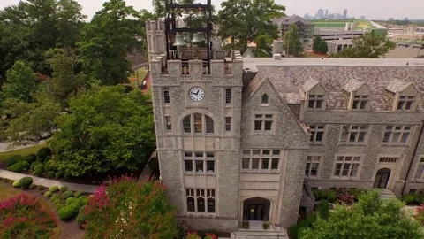 Historic campus building with clock tower and carillon Video stock 85276956
