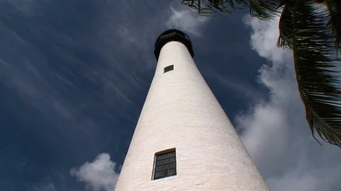 Historic Cape Florida Lighthouse-static shot-ground perspective-palm tree-sun Stock Footage 115089639