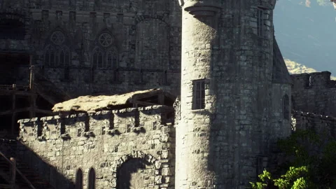 Historic Castle Stands Majestically Against a Backdrop of Mountains Stock Footage 344928261