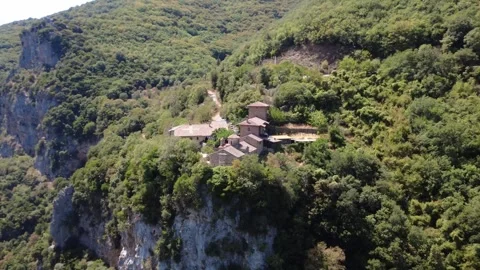 Historic Christian Monastery Overlooking Deep Gorge and Wild Forest Stock Footage 325226845