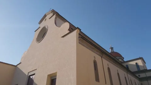 Historic Church Facade with Round Window and Blue Sky in Florence Italy Видео 340749622