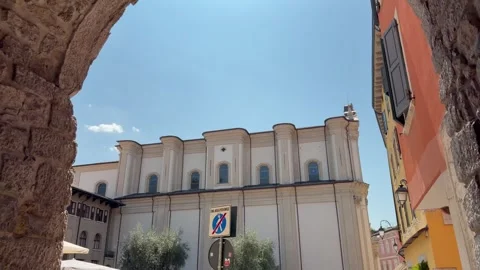 Historic Church Through Stone Arch in Riva del Garda Old Town Lake Garda Italy Vídeo Stock 341504792