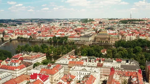 Historic cityscape of Prague featuring classic red roofs along Vltava river 動画素材 341344832