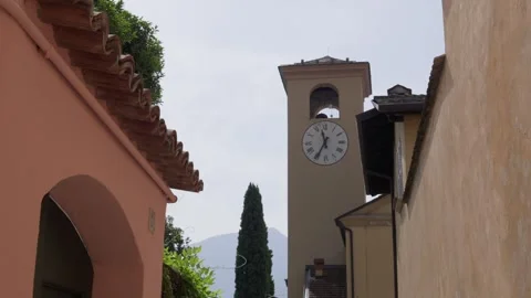Historic clock church tower in the main square of Gravedona town Italy Italian Stock Footage 333489132