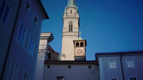 Historic clock with little tower in front of church tower Salzburg Austria Stock Footage 281651016