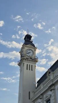 Historic clock tower against cloudy blue sky 스톡 사진