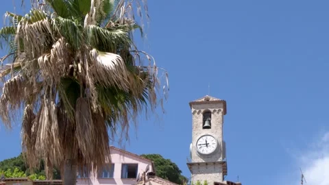 Historic Clock Tower and Palm Tree in Cannes Old Town Stock Footage 335359521