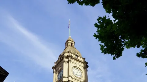 Historic Clock Tower with the Australian flag in Central Melbourne Stock Footage 324692823