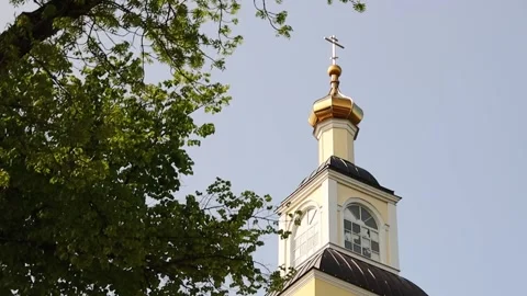 A historic clock tower with a functional weather vane on top, suitable for use Stock Footage 311434367