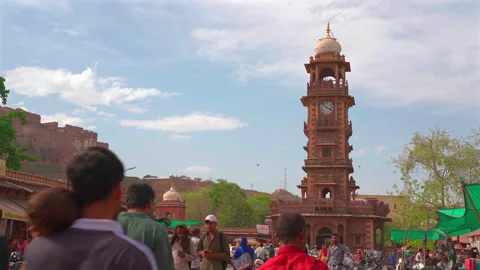 Historic Clock Tower Market Square with Mehrangarh Fort in Jodhpur Stock Footage 335374728