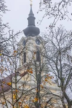 Historic Clock Tower Overlooking Red Tile Roofs, Church of Saints Eusebius .. Stock Photos