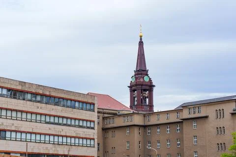 Historic Clock Tower Surrounded By Modern Architecture In Berlin 스톡 사진