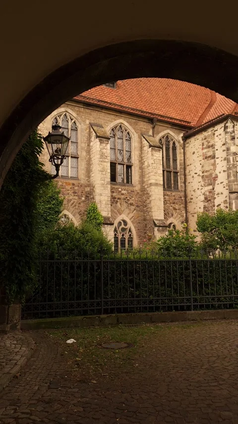 Historic Courtyard Framed by Stone Arch in Magdeburg Germany Stock Footage 340503021