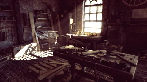 Historic craft workshop featuring aged equipment and sunlit dust particles Stock Footage 333555144