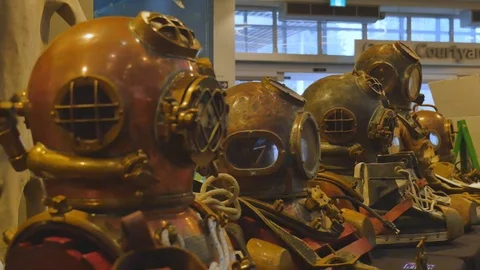 Historic dive helmets line up 4K Stock Footage 126662181