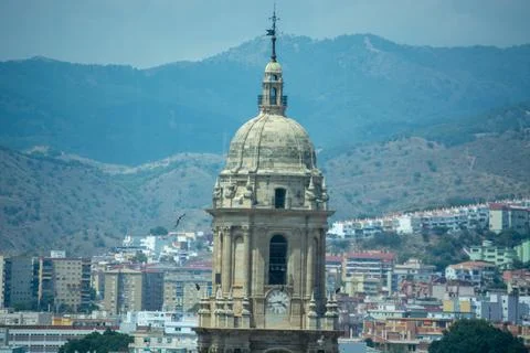 Historic dome structure with clock against mountainous backdrop Stock Photos