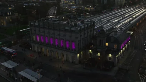 Historic Dublin Train Station Illuminated by Vibrant Evening Lights Stock Footage 332444510
